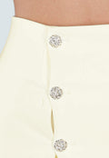 Butter Yellow Mini Rok met Overslag en Goudkleurige Knopen aan Voorkant