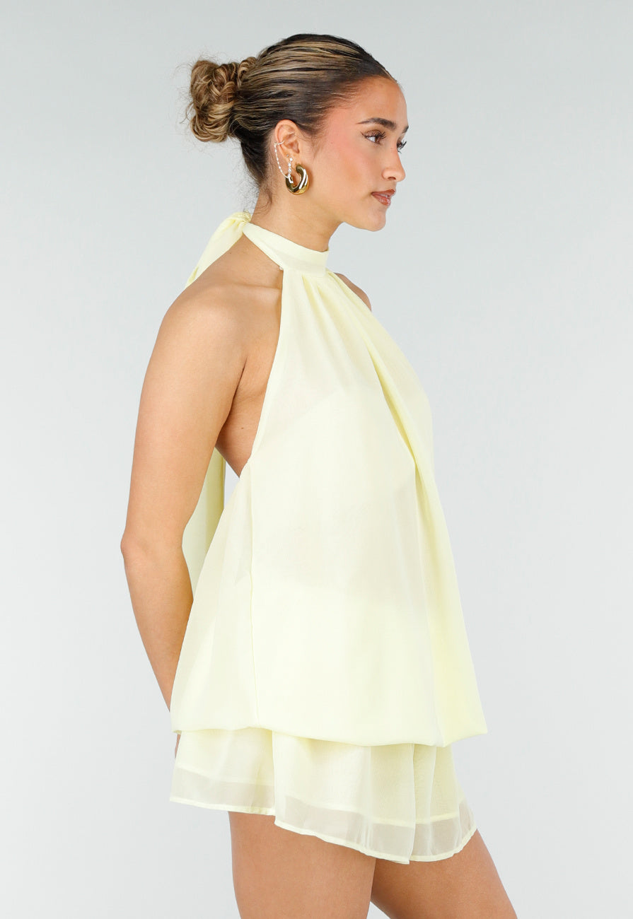 Butter Yellow Halter Jurk met Gelaagde Rok en Open Rug
