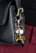 Goudkleurige Tashanger/Sleutelhanger met Leopard Strik, Kralen en Kwastje