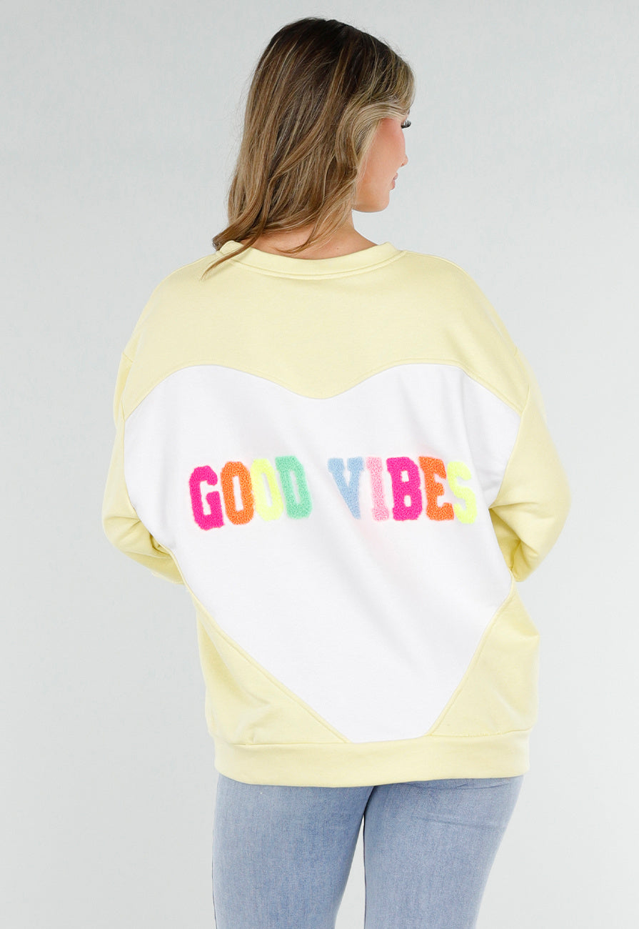 Gele Sweater met Good Vibes Print op Rug