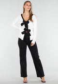 Witte Cardigan met Zwarte Strikken en Lange Mouwen