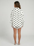 Witte Mousseline Two Piece met Zwarte Hartjes en Ruffles